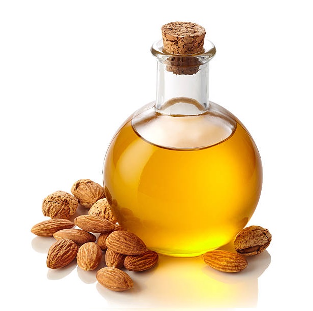 Bottle of almond oil isolated on white background